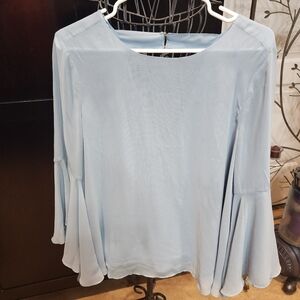 Open back, semi sheer lined blouse